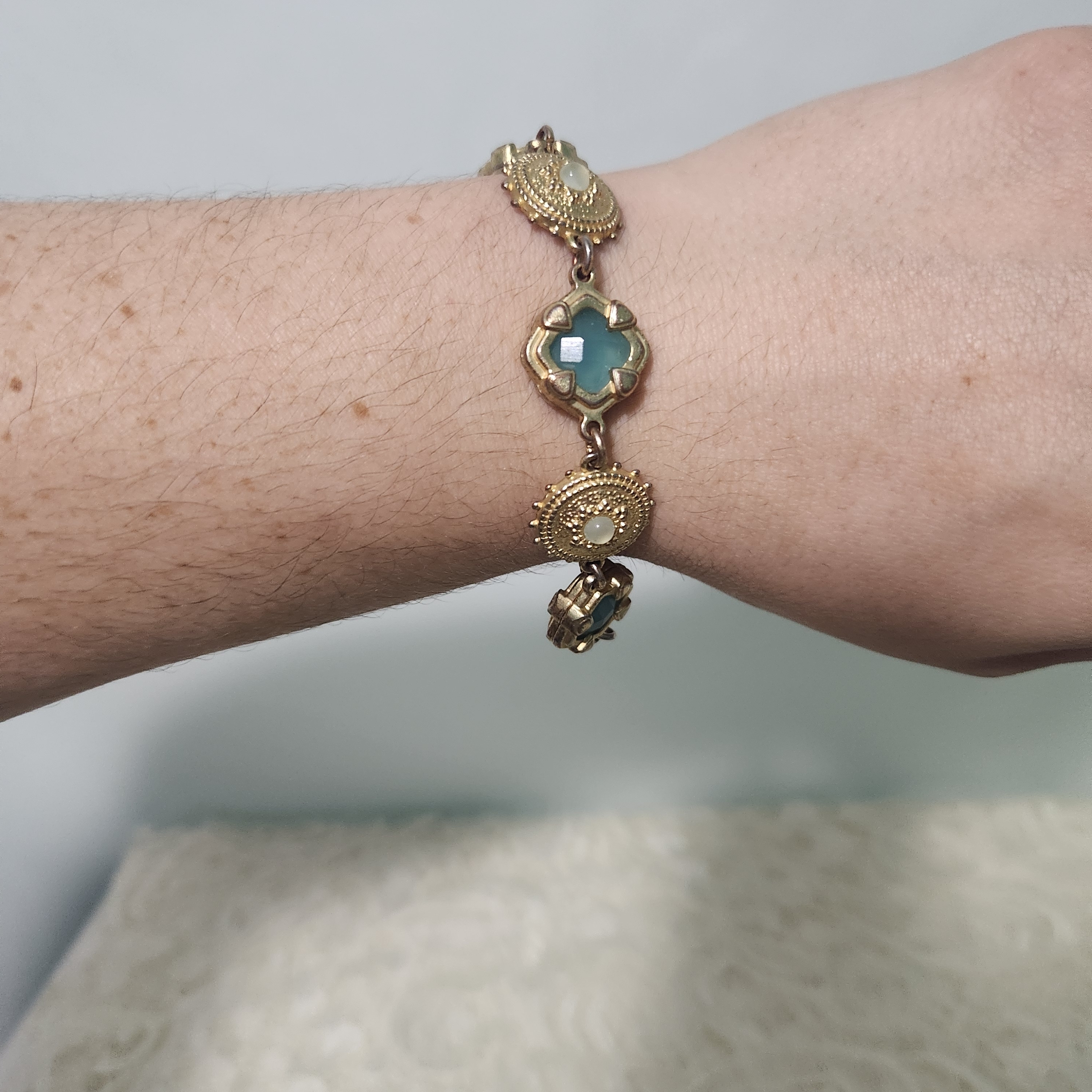 George Ornate Filigree-Style Aqua Glass Cabochon In Gold Tones Bracelet.